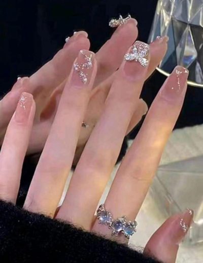 24-Piece Nude Pink Press-On Nails Set with Rhinestone Bow and Glitter French Tip Design